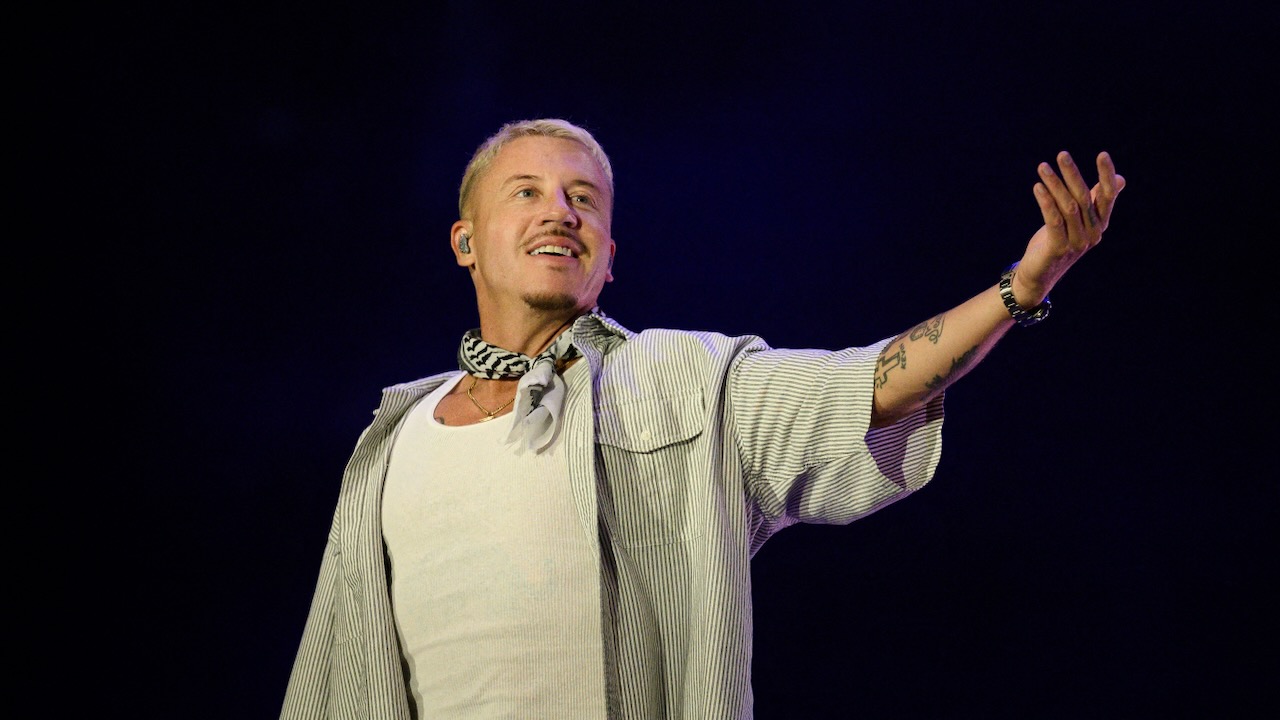 Macklemore, photo by ARNAUD FINISTRE / AFP via Getty Images